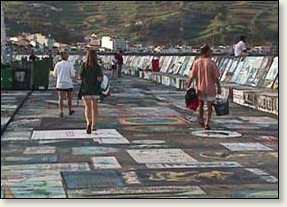 More boat art along the harbor wall