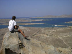 Ryan Martell surveys the scene atop Mt. Kythnos