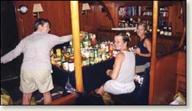 Tanna Jones, Angie Hunter, and Tamra Strentz stow food aboard Valkyrie for the Atlantic Crossing