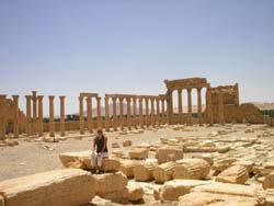 Tamra Strentz sitting amongst the ruins in Palmrya, Syria